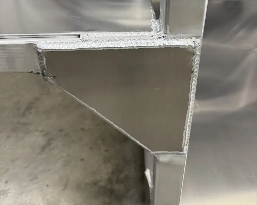 TIG welded gusset and top rail on an aluminum cart Neal built