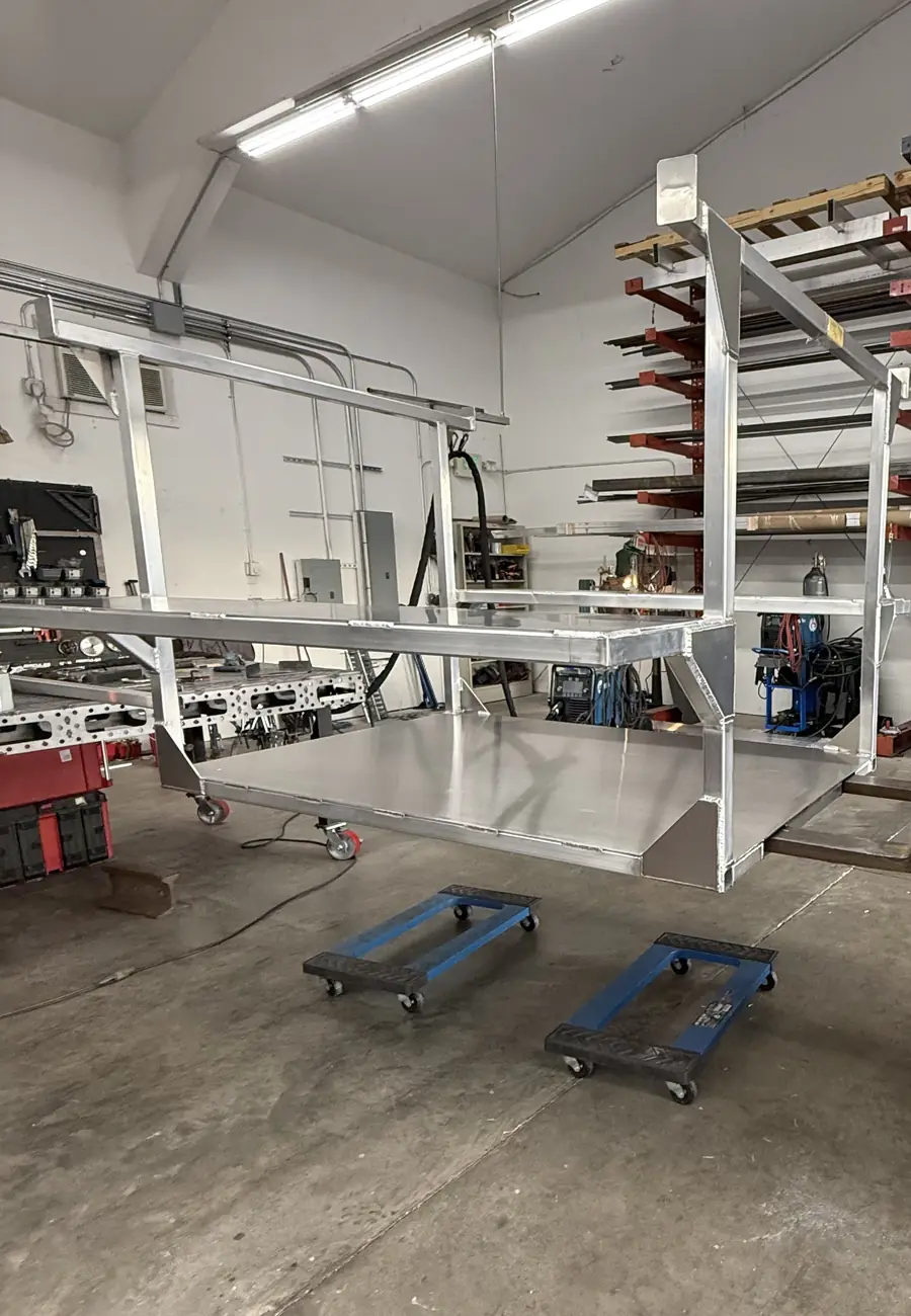 Two-level aluminum cart lifted off the shop floor for a move
