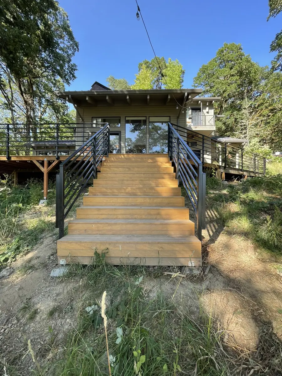 Deck stairs with black horizontal bar steel railings