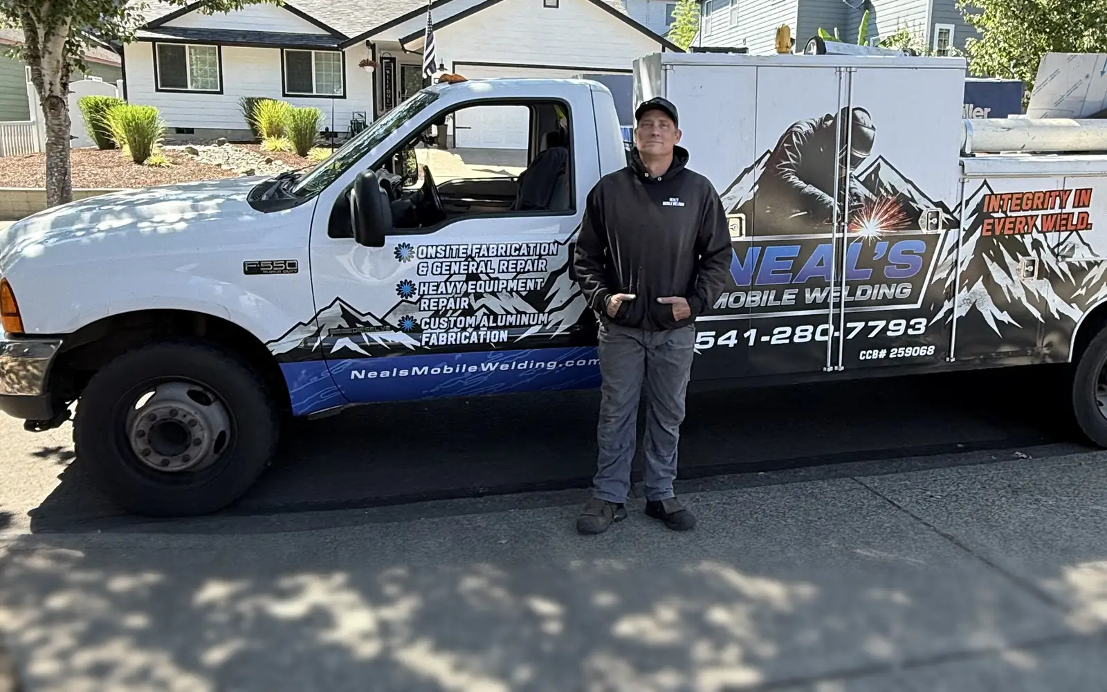 Neal standing next to his welding truck