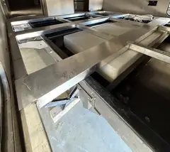 Aluminum tube floor frame Neal rebuilt and welded in place inside an RV