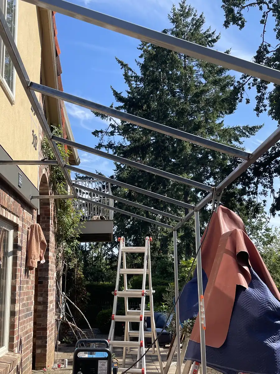 Trellis frame going up beside a house